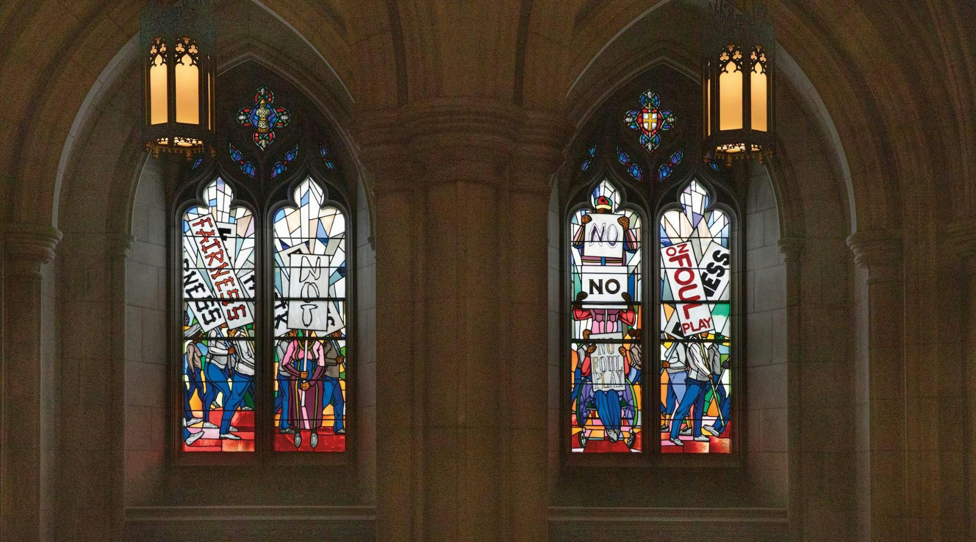 A stained glass installation by Kerry James Marshall, titled "The Now and Forever Windows," dated 2023