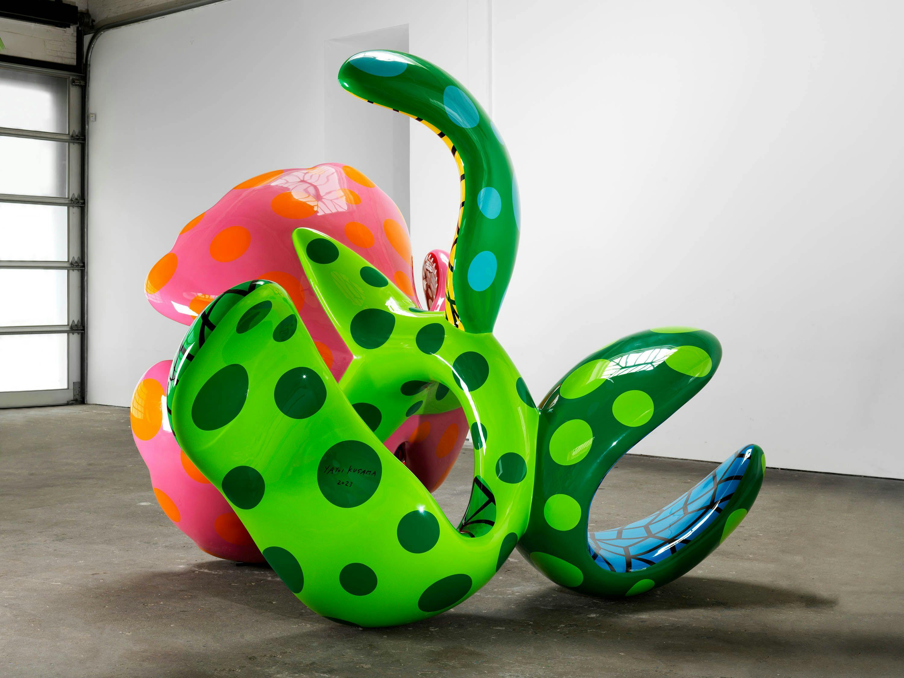 A sculpture by Yayoi Kusama, titled I Spend Each Day Embracing Flowers, dated 2023.