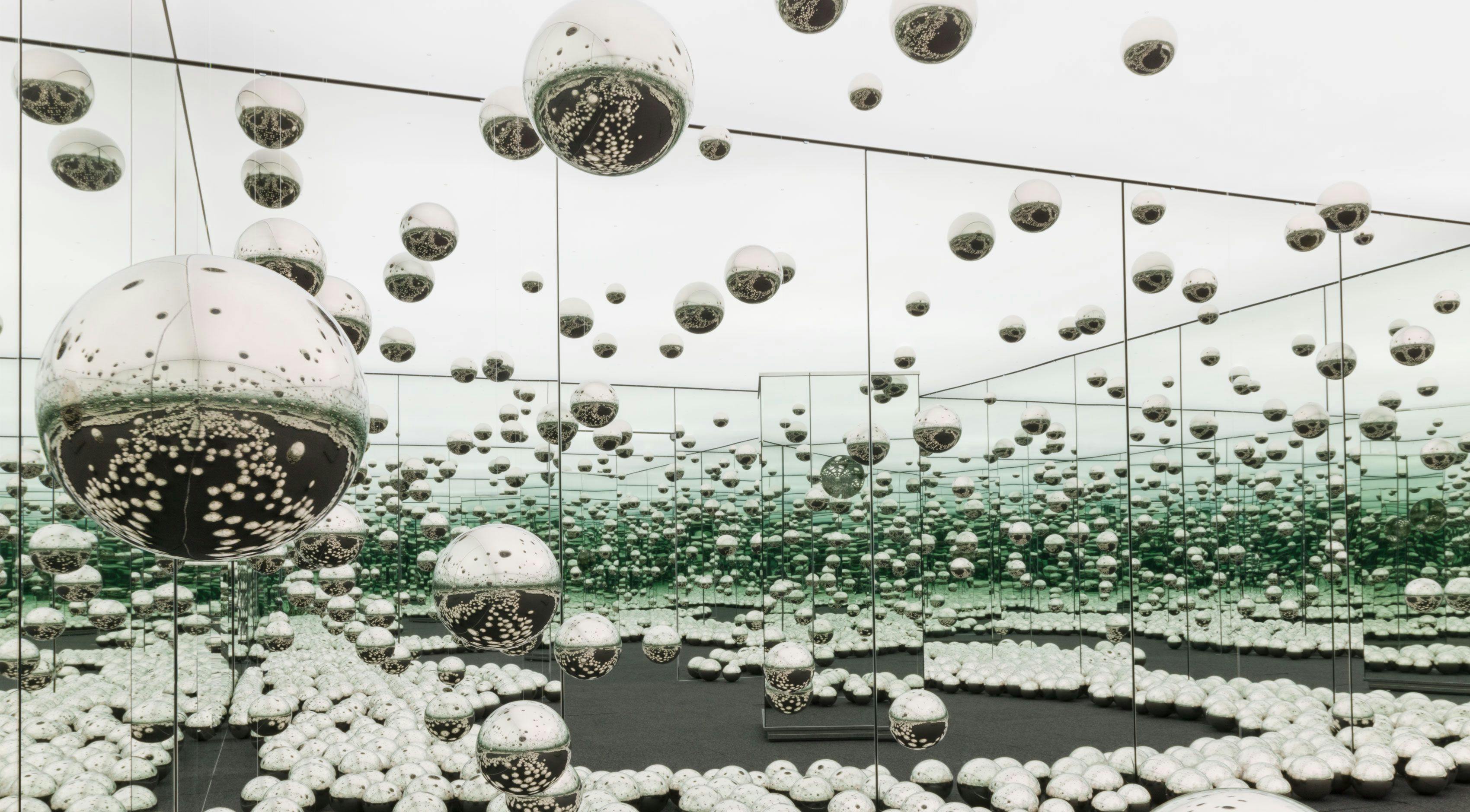 An experiential installation by Yayoi Kusama, comprised of mirrors, wood, LED lighting system, metal, and carpeting, titled Infinity Mirrored Room - Let&#039;s Survive Forever, dated 2017.