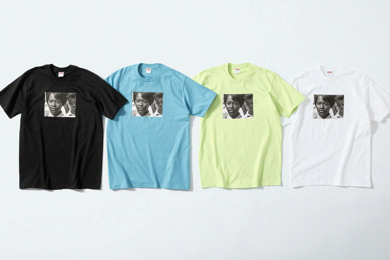 A photograph of four different colored T-shirts by Supreme from the front, featuring a photograph by Roy DeCarava.