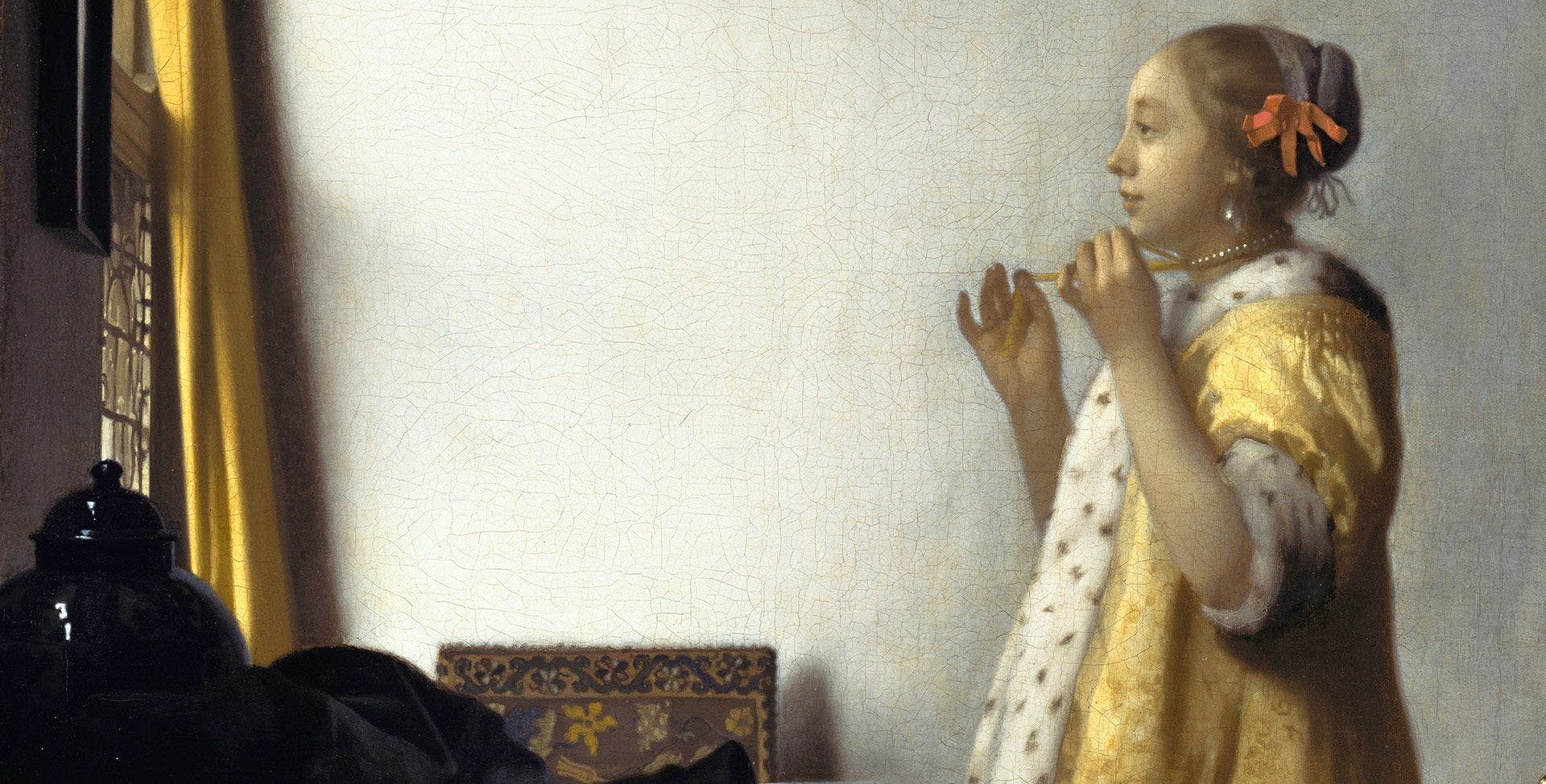 A detail from a painting by Johannes Vermeer, titled Young Woman with a Pearl Necklace, dated 1664.