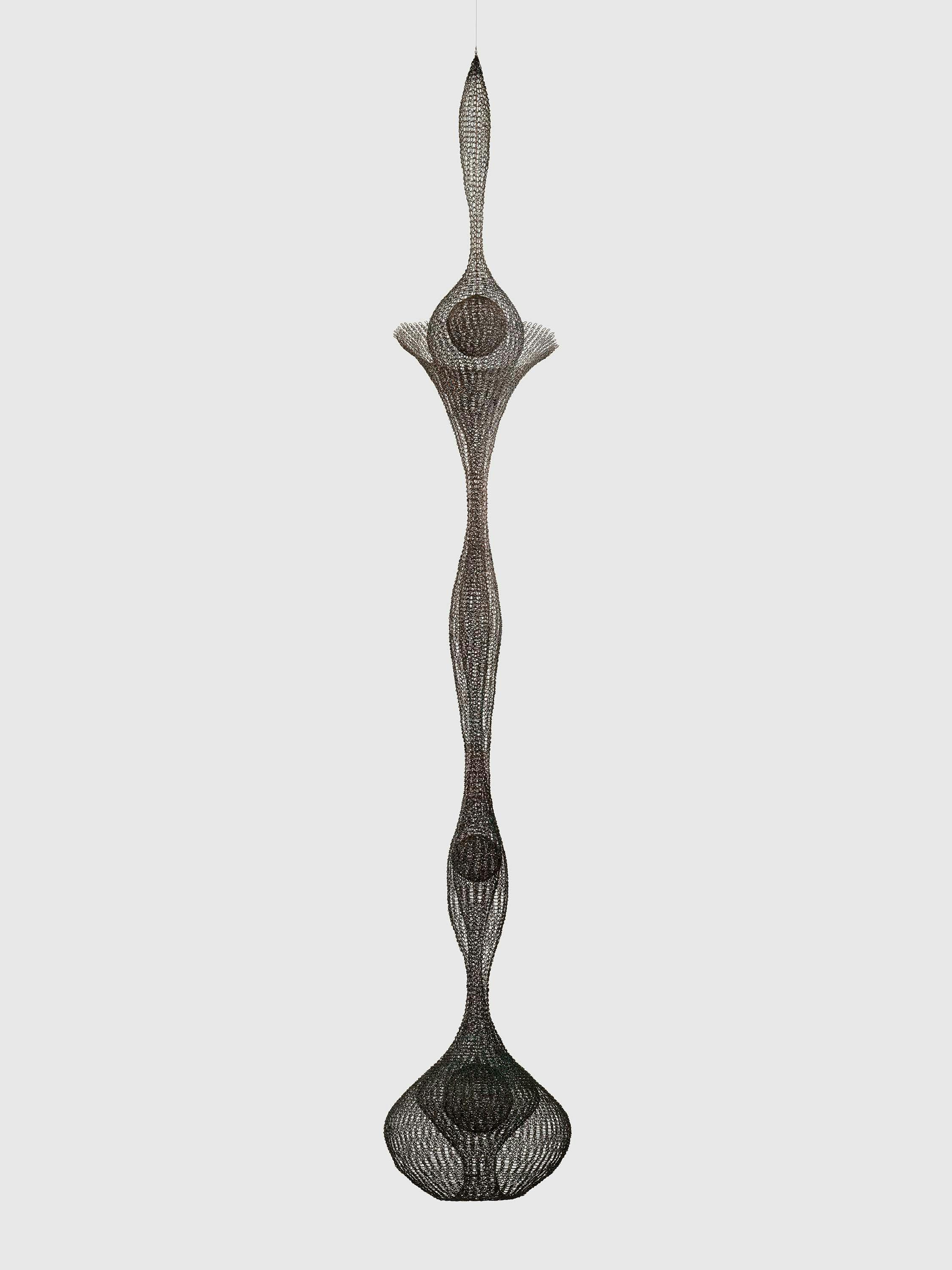 A sculpture by Ruth Asawa, titled Untitled (S.765, Hanging Five-Lobed Continuous Form Within a Form with a Large Open Collar and Three Interior Spheres), circa 1952 to 1953.