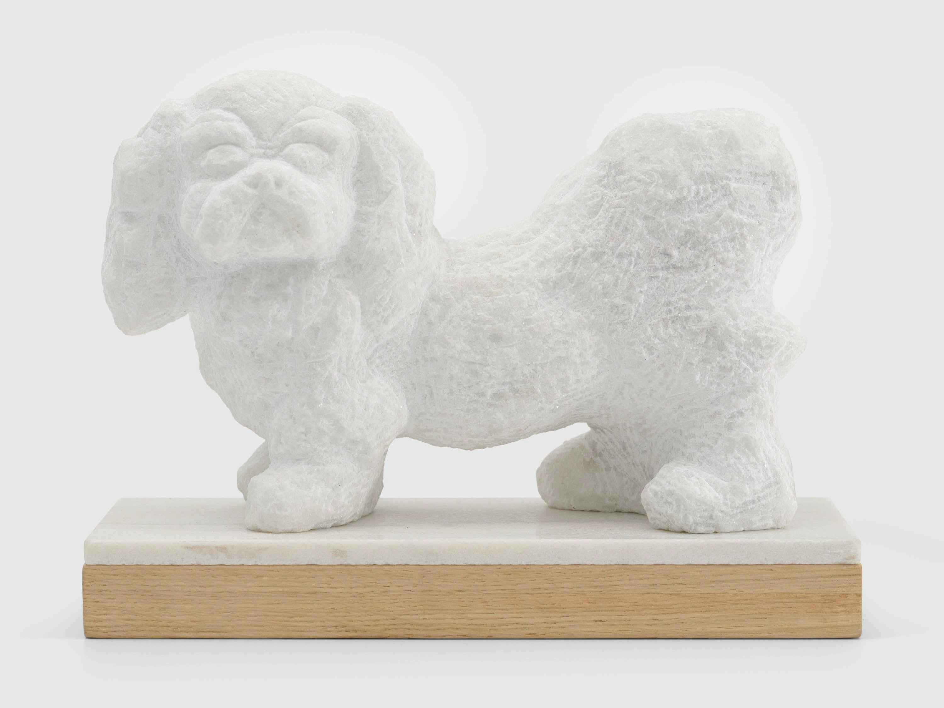 A marble sculpture by Declan Kearns, titled Poochie, dated 2021.