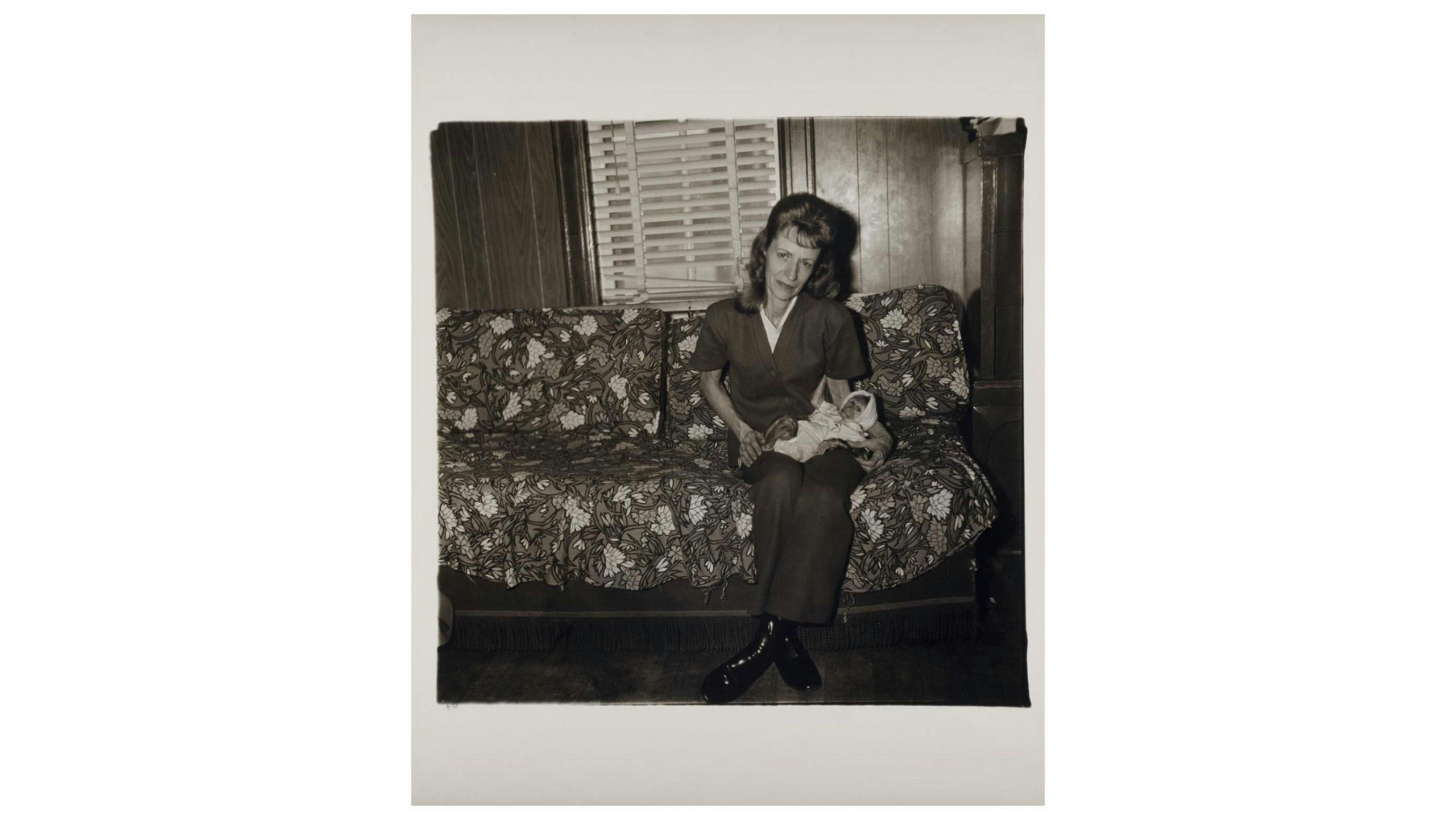 A photograph by Diane Arbus, titled Mrs. Gladys ‘Mitzi’ Ulrich with the baby, Sam, a stump-tailed macaque monkey, North Bergen N.J. 1971, Smithsonian American Art Museum, Museum purchase.