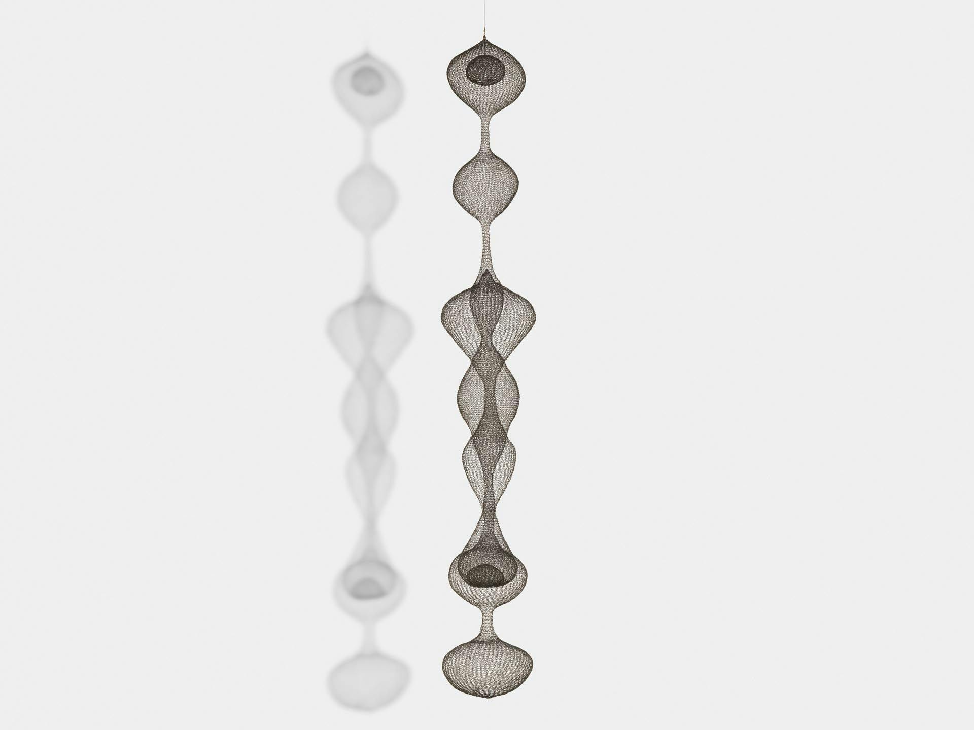 A sculpture by Ruth Asawa, titled Untitled (S.272, Hanging Seven-Lobed, Continuous Interwoven Form, with Spheres within Two Lobes), dated  circa 1954.