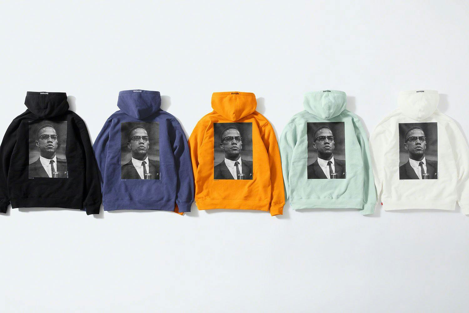 A photograph of five different colored hoodies by Supreme from the back, featuring a photograph by Roy DeCarava.